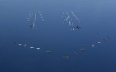 South Korean fighters flying in formation during a large-scale simulation of a sortie to attack North Korea's key military facilities at an undisclosed location. Picture: EPA/SOUTH KOREAN AIR FORCE