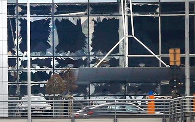 Broken windows seen at the scene of explosions at Zaventem airport near Brussels, Belgium. Picture: REUTERS