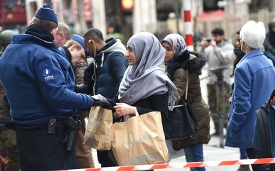 Police carry out checks at the Central Station in Brussels on Wednesday, a day after blasts hit the Belgian capital.  Picture: AFP PHOTO/PATRIK STOLLARZ