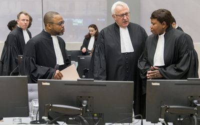Senior Trial Lawyer Jean-Jacques Badibanga (L), Deputy Prosecutor James Stewart (C),  and Chief Prosecutor Fatou Bensouda are seen in a court room of the ICC before the delivery of the judgment in the case of Jean-Pierre Bemba Gombo in the Hague, March 21, 2016. Picture: REUTERS/JERRY LAMPEN
