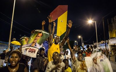 Supporters of incumbent President Denis Sassou Nguessu celebrate in the streets of Brazzaville after information of an early lead in the electoral results spread through the city on Tuesday, March 22 2016. 
Picture: AFP
