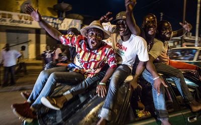 Supporters of President Denis Sassou Nguessu celebrate in the streets of Brazzaville after information of an early lead in the electoral results spread through the city. Picture: AFP
