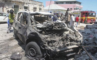 The remains of a destroyed car is seen at the scene of a car bomb attack in Mogadishu, Somalia, 09 April 2016. Picture: EPA/SAID YUSUF WARSAME