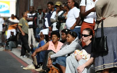 GLUM:  Unemployed people queue for UIF payments. In its finding on the extension of collective bargaining agreements, the high court said unemployment was the most intractable problem in SA. Picture: SUNDAY TIMES