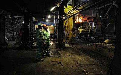 AT WORK: A steel rod is heated at the Scaw Metals plant in Germiston. File picture: SOWETAN