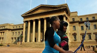 HIGHER LEARNING: Students stroll past the University of the Witwatersrand's Great Hall. Picture: THE TIMES