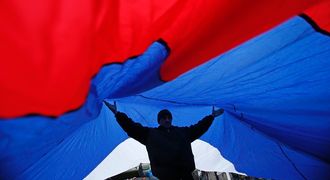 People carry a giant Russian flag during a pro-Russian rally in Simferopol, Crimea, on Thursday.  Picture: REUTERS