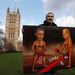 Artist Kaya Mar holds a satirical painting depicting US President Barack Obama and Russian President Vladimir Putin in Ukraine, outside the Houses of Parliament in London on Tuesday. Picture: REUTERS