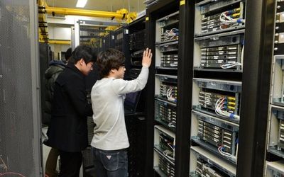 Employees of the Korean Broadcasting System inspect a server to recover it at the company's main office in Seoul on Thursday. Picture: REUTERS