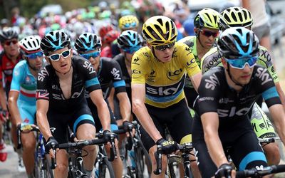 Team Sky’s Chris Froome of the UK in the yellow jersey, is shielded by teammates Leopold Konig (right) of Czech Republic and Welshman Geraint Thomas (second left) under the watchful eye of Alberto Contador (back right) of Spain. Picture: DOUG PENSINGER/ GETTY IMAGES