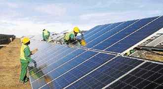 Workers assemble the Kalkbult solar energy plant in the Karoo, the first solar energy plant to feed into the national grid. SA is in the vanguard of Africa’s efforts to use renewable energy to increase power supply to the masses. Picture: SUNDAY TIMES
