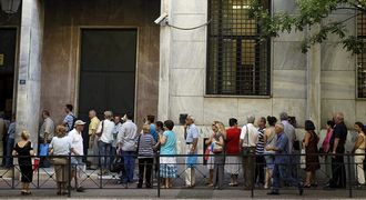 People line up to request loans settlements or proceed with bank transactions, in Athens, Greece, in July. Picture: EPA/ORESTIS PANAGIOTOU