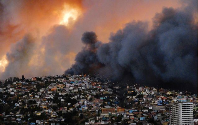 Smoke from a forest fire is seen in Valparaiso, northwest of Santiago, on Sunday. Picture: REUTERS