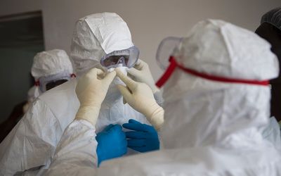 Health workers don protective equipment at the Island Clinic in Monrovia. Picture: REUTERS