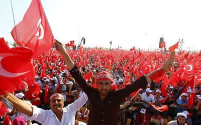 IN FORCE:  People wave national flags in Istanbul during the Democracy and Martyrs Rally organised by Turkish President Tayyip Erdogan and supported by the ruling AK Party, opposition Republican People’s Party and Nationalist Movement Party. Picture: REUTERS/UMIT BEKTAS