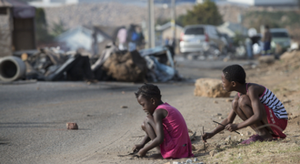 Children play in Alexandra, Johannesburg on Saturday, a day after violent protests in the township. Picture: AFP PHOTO
