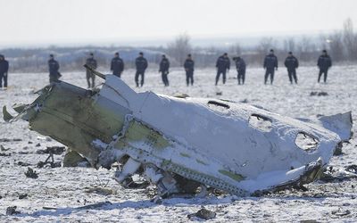Emergencies Ministry members work at the crash site of a Boeing 737-800 Flight FZ981 operated by Dubai-based budget carrier Flydubai, at the airport of Rostov-On-Don, Russia, on Sunday. Picture: REUTERS