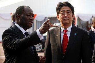 Côte d'Ivoire President Alassane Ouattara, left, talks with Japanese Prime Minister Shinzo Abe at the presidential palace in Abidjan last week.  Picture: REUTERS
